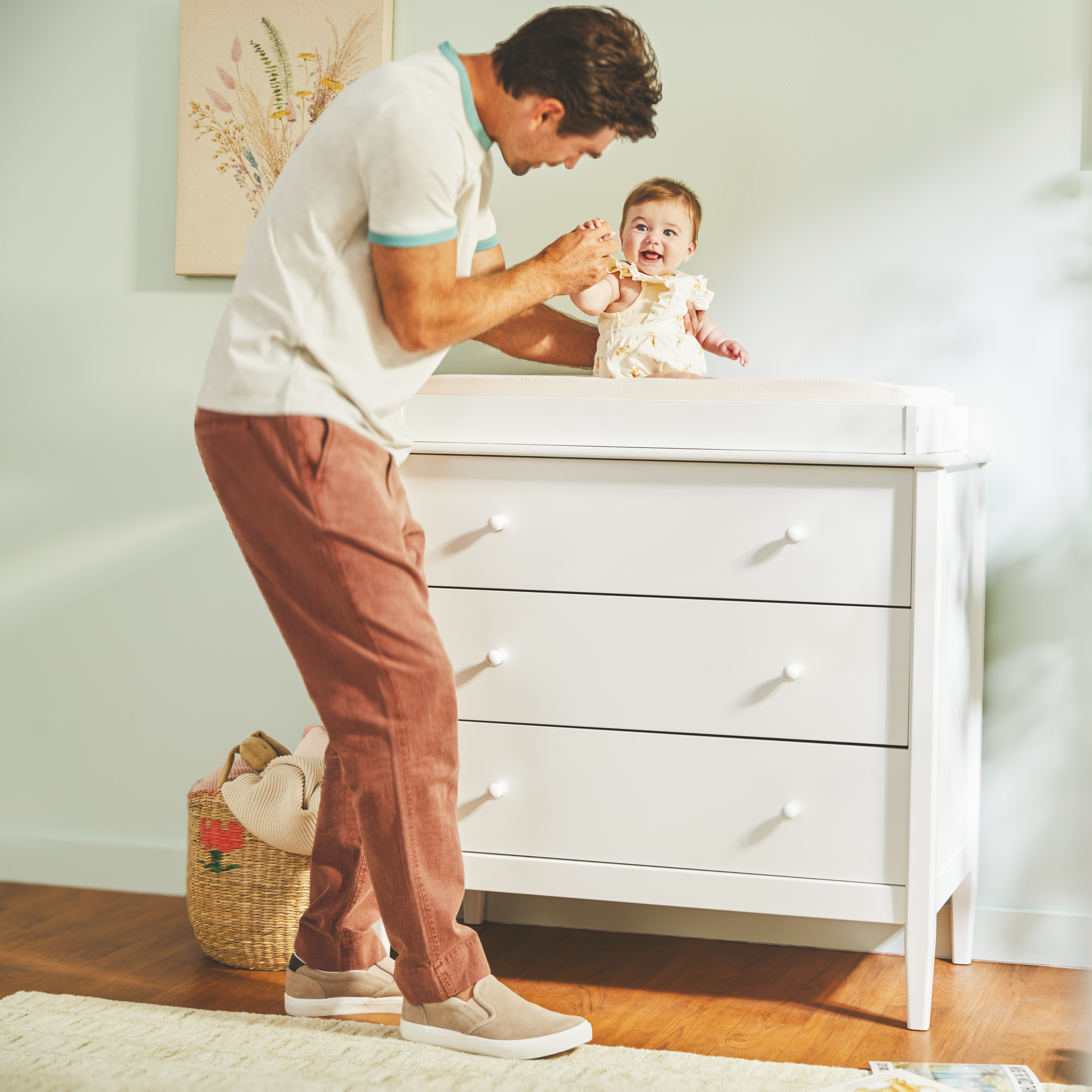 Single Topper - father interacting with baby on dresser topper