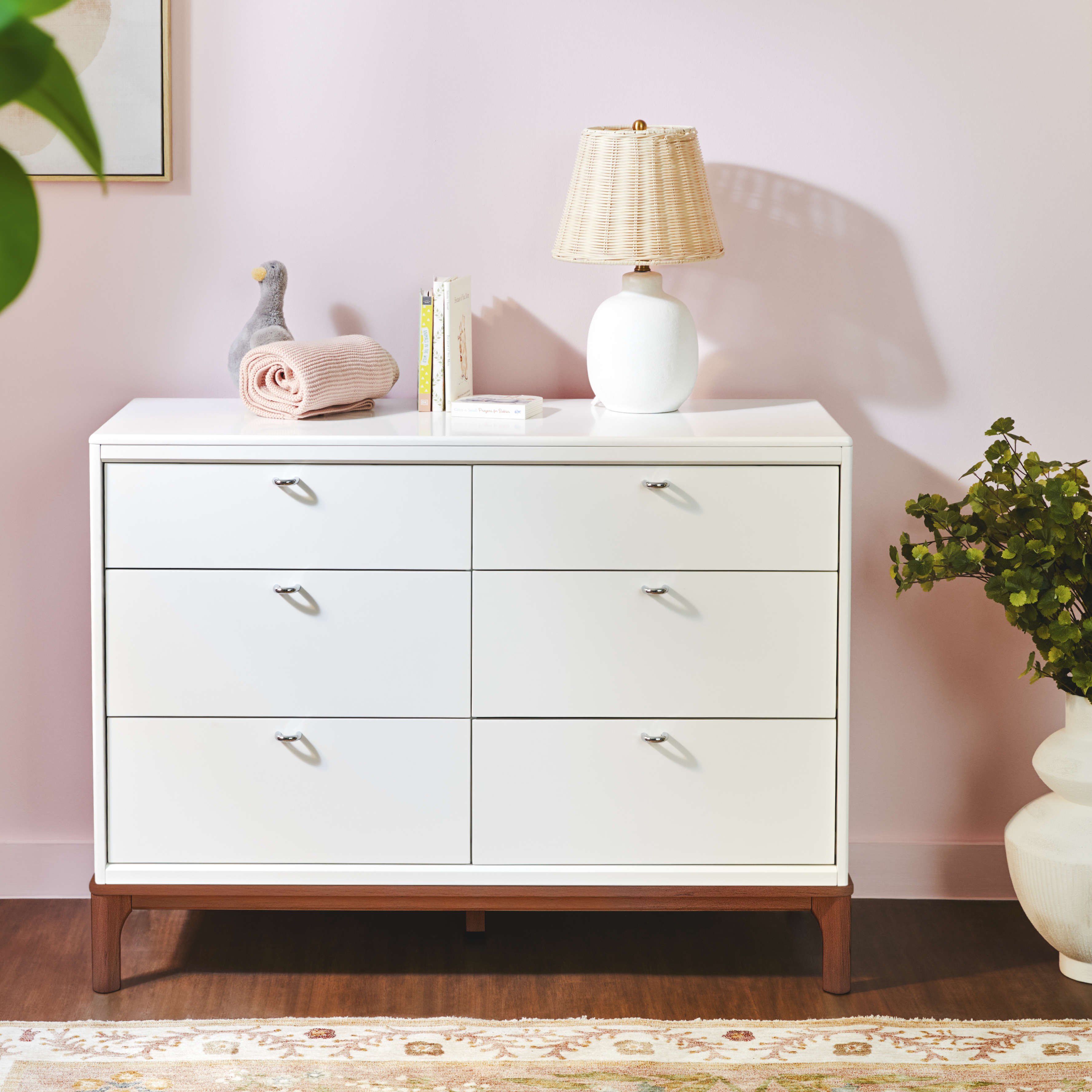 Laurel 6-Drawer Double Dresser with lamp, books, and other items on top